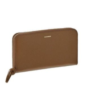 Jil Sander full sized zip around wallet. New in mint condition.:) still has tags